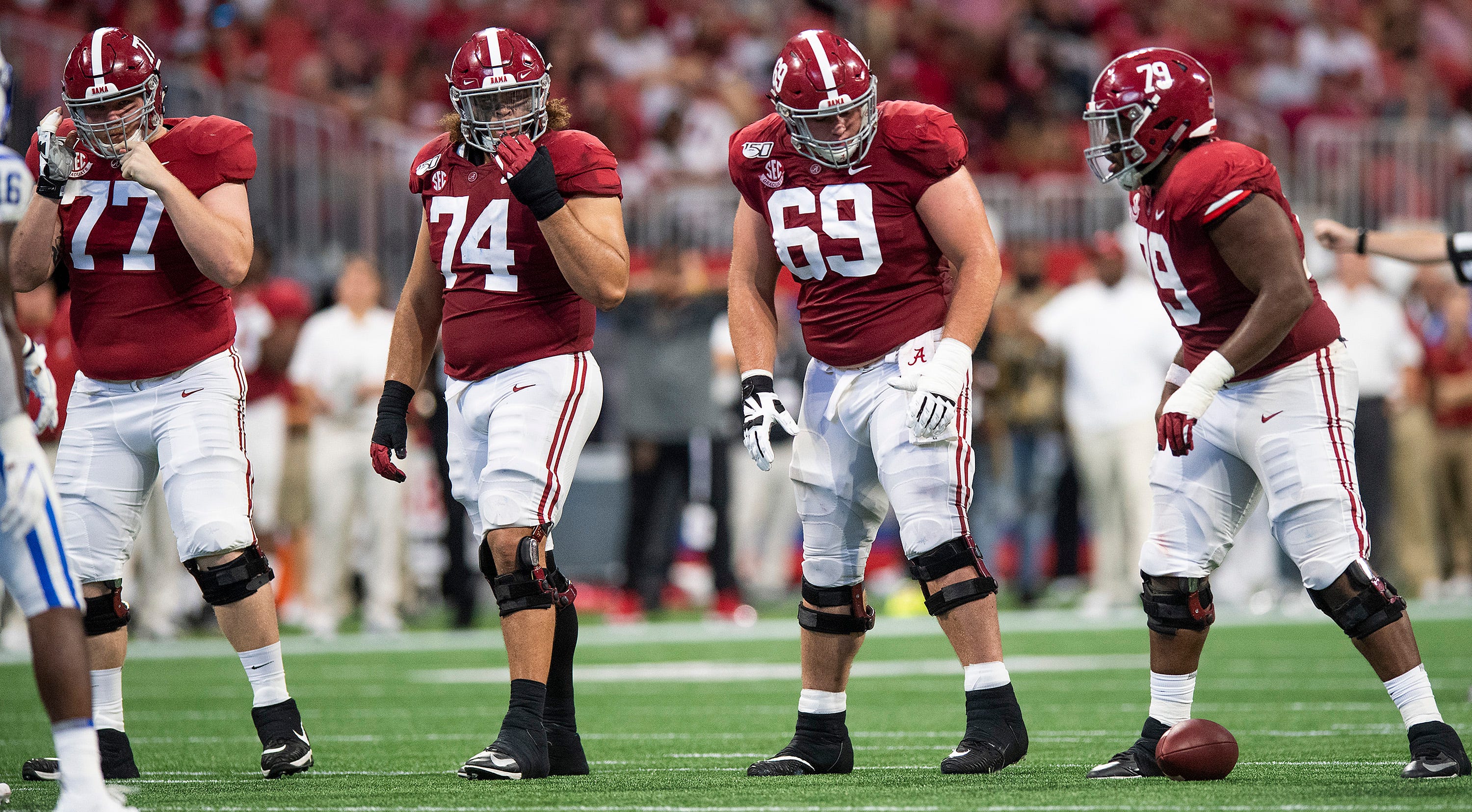 Alabama offensive linemen Matt Womack (77), Jedrick Wills, Jr., (74), Landon Dickerson (69) and Chris Owens (79) line up against Duke in the Chick-fil-A Kickoff Game at Mercedes Benz Stadium in Atlanta, Ga., on Saturday August 31, 2019.