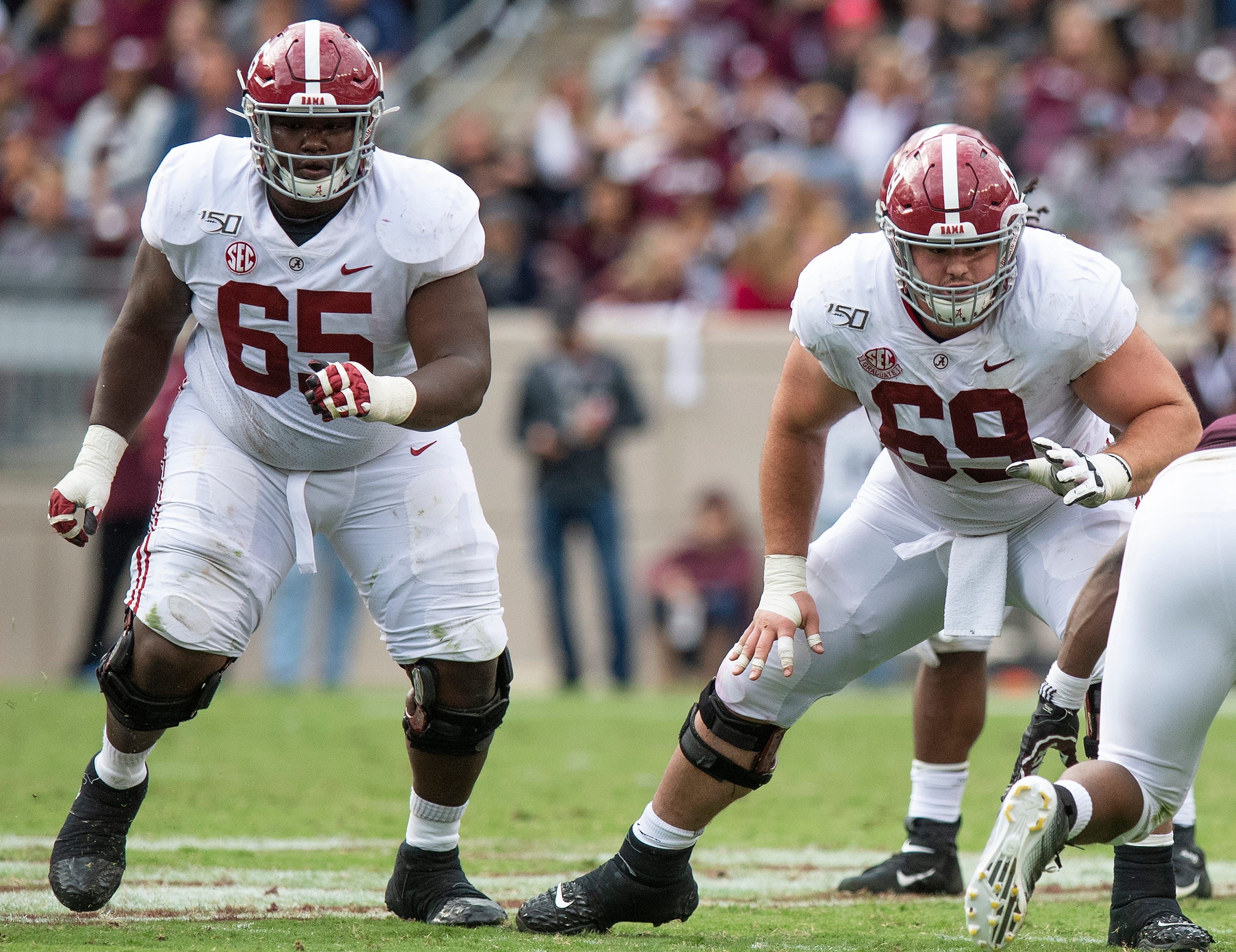 Alabama offensive linemen Deonte Brown (65) and Landon Dickerson (69) touchdown at Kyle Field in College Station, Texas on Saturday October 12, 2019.