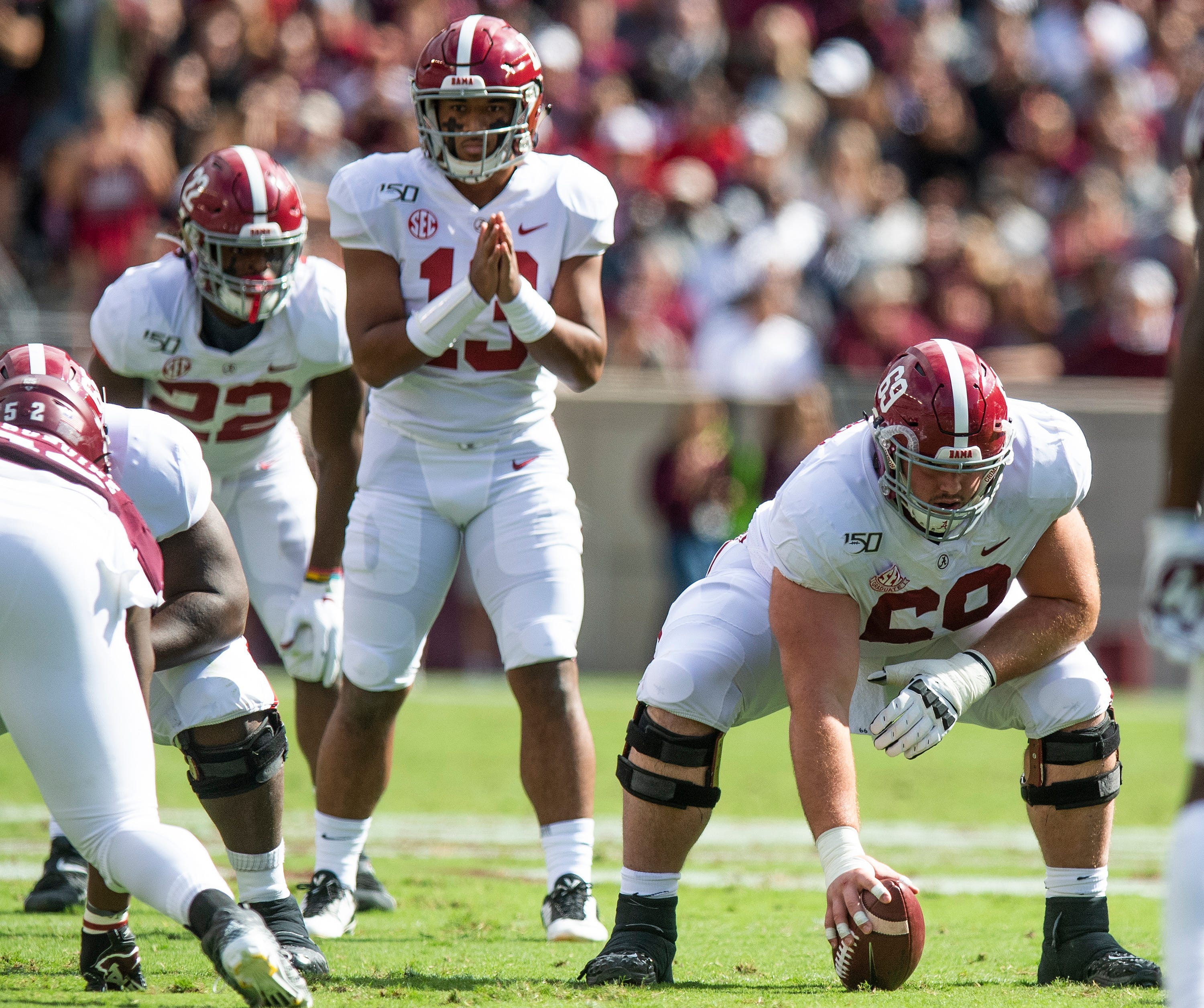 Alabama center Landon Dickerson (69) with quarterback Tua Tagovailoa (13) against Texas A&M at Kyle Field in College Station, Texas on Saturday October 12, 2019.