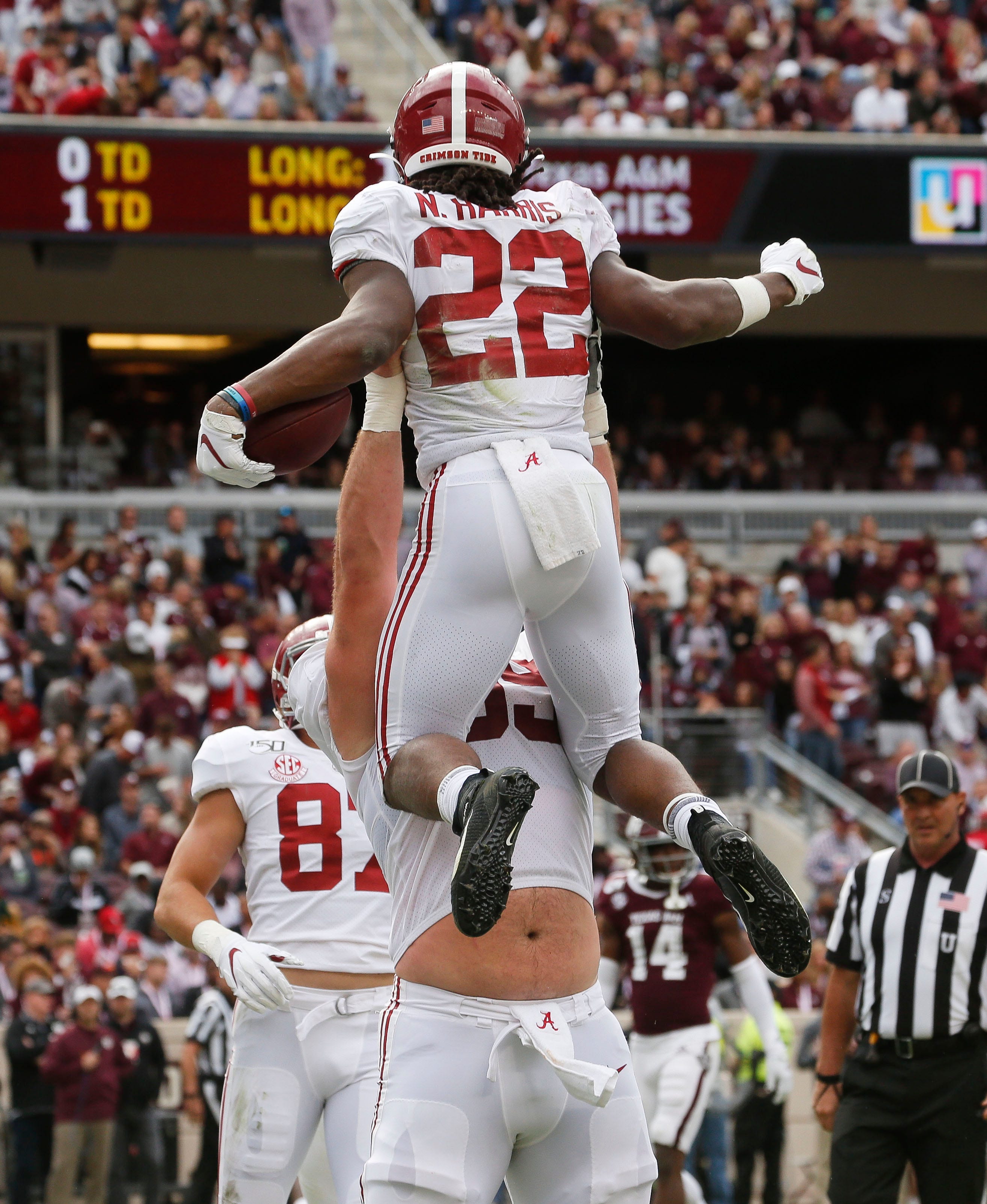 Alabama offensive lineman Landon Dickerson (69) lifts Alabama running back Najee Harris (22) as they celebrate a touchdown during the first half at Kyle Field Saturday, Oct. 12, 2019 in College Station, Texas. [Staff Photo/Gary Cosby Jr.]