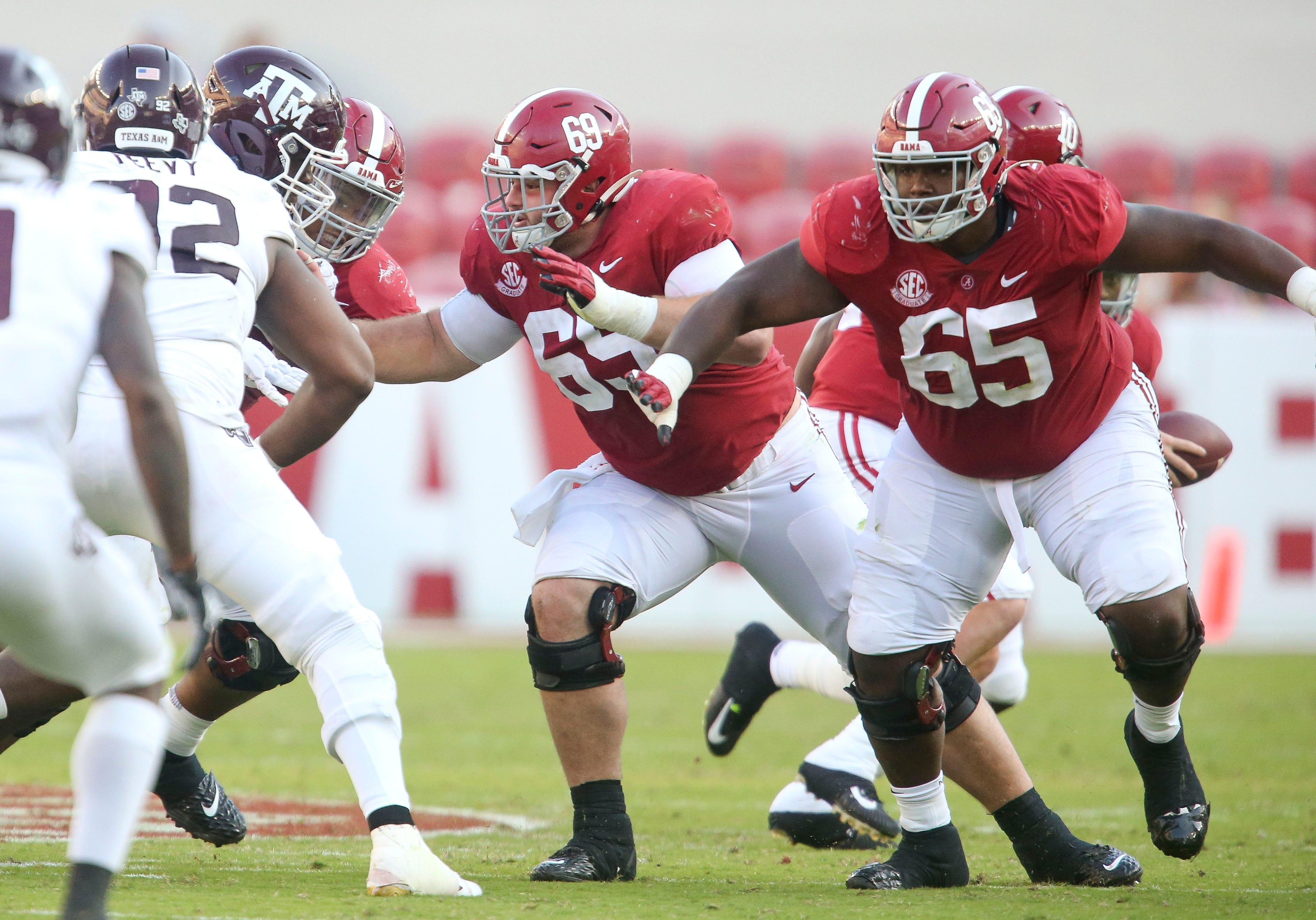Alabama offensive lineman Landon Dickerson (69) and Alabama offensive lineman Deonte Brown (65) block during Alabama's game with Texas A&M Saturday, Oct. 3, 2020, in Bryant-Denny Stadium. [Staff Photo/Gary Cosby Jr.]